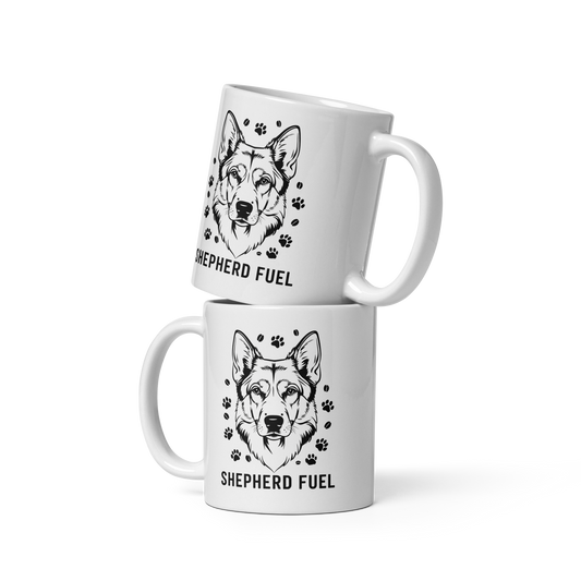Two white mugs with black dog illustrations and 'Shepherd Fuel' text on a white background